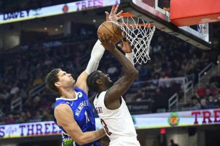 Dec 21, 2022; Cleveland, Ohio, USA; Milwaukee Bucks center Brook Lopez (11) defends a shot by Cleveland Cavaliers guard Caris LeVert (3) in the second quarter at Rocket Mortgage FieldHouse. Mandatory Credit: David Richard-USA TODAY Sports (NBA Rumors)