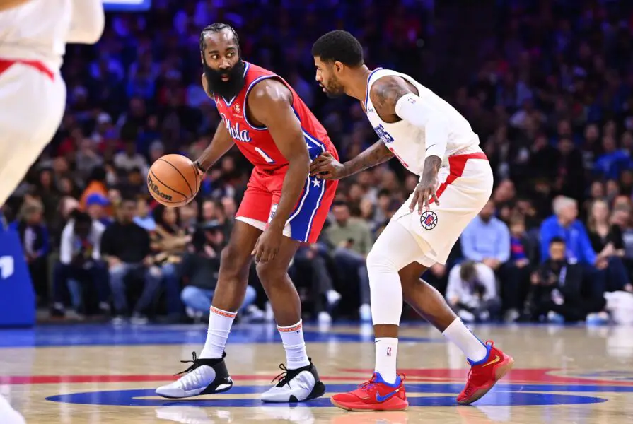 Dec 23, 2022; Philadelphia, Pennsylvania, USA; Philadelphia 76ers guard James Harden (1) shields the ball from Los Angeles Clippers forward Paul George (13) in the first quarter at Wells Fargo Center. Mandatory Credit: Kyle Ross-USA TODAY Sports (NBA Rumors)