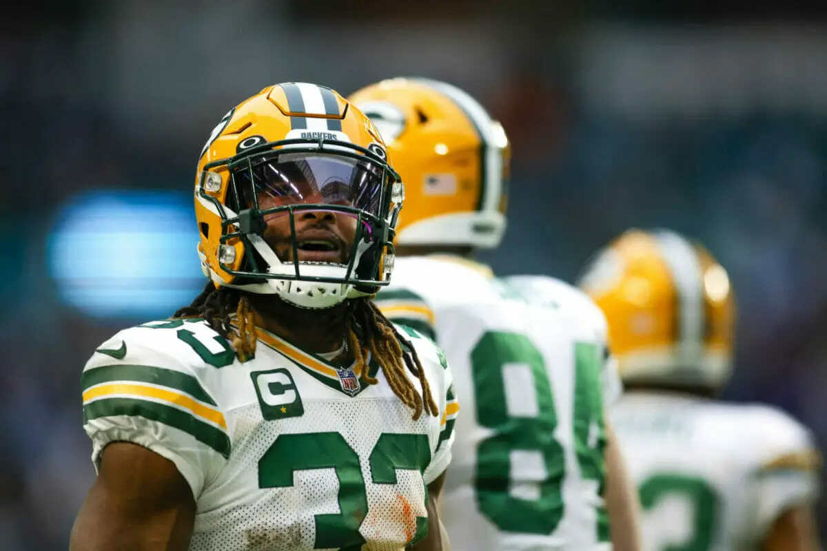Dec 25, 2022; Miami Gardens, Florida, USA; Green Bay Packers running back Aaron Jones (33) looks on from the field after running with the football during the fourth quarter against the Miami Dolphins at Hard Rock Stadium. Mandatory Credit: Sam Navarro-USA TODAY Sports (NFL News)