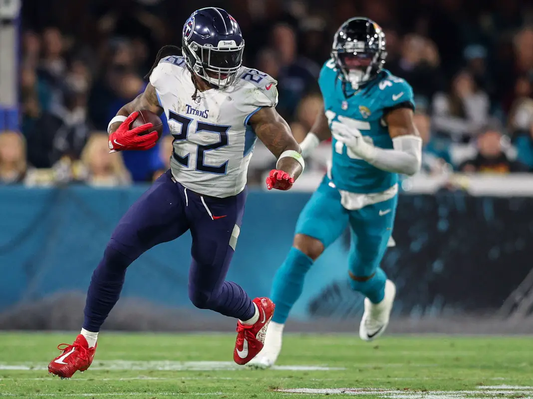 Jan 7, 2023; Jacksonville, Florida, USA; Tennessee Titans running back Derrick Henry (22) runs with the ball against the Jacksonville Jaguars in the second quarter at TIAA Bank Field. Mandatory Credit: Nathan Ray Seebeck-USA TODAY Sports (Wisconsin Badgers News)