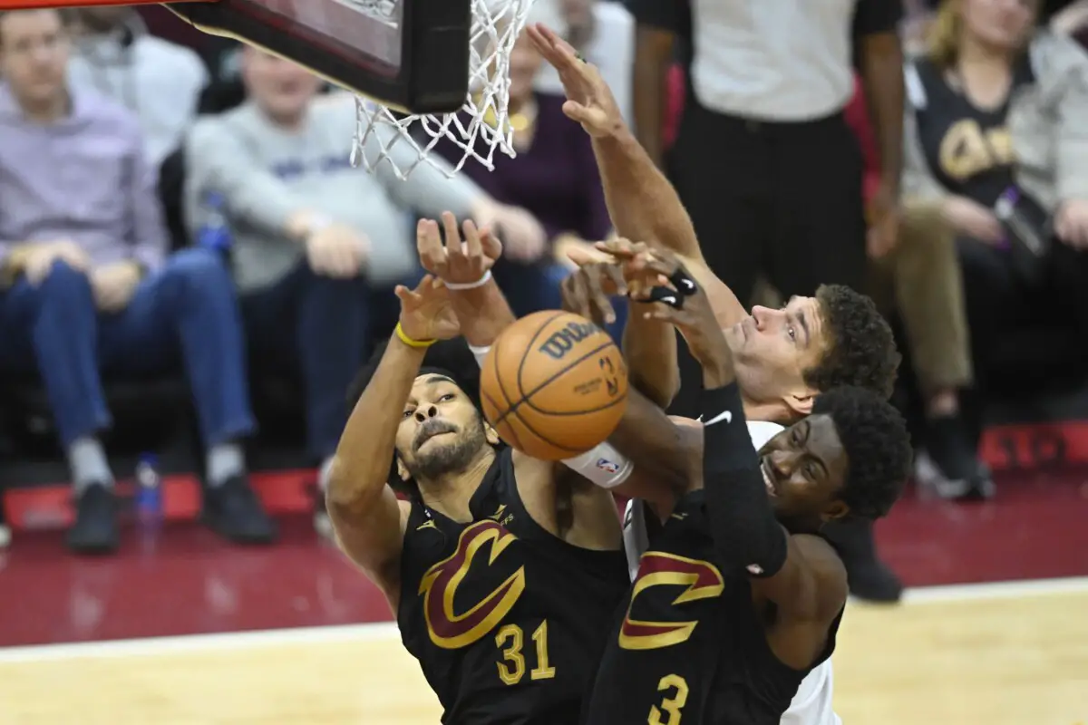 Jan 21, 2023; Cleveland, Ohio, USA; Cleveland Cavaliers center Jarrett Allen (31) and guard Caris LeVert (3) reach for a rebound beside Milwaukee Bucks center Brook Lopez (11) in the fourth quarter at Rocket Mortgage FieldHouse. Mandatory Credit: David Richard-USA TODAY Sports (NBA Rumors)