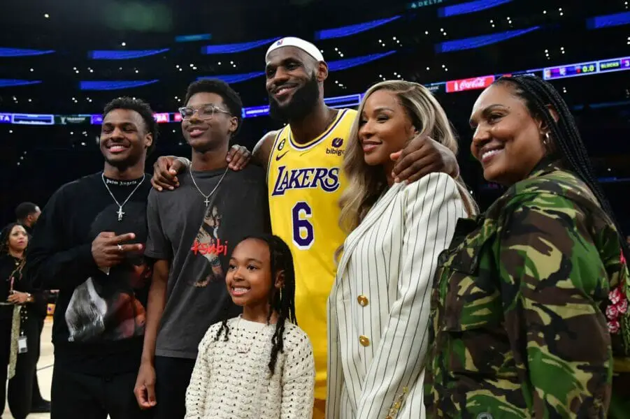 Feb 7, 2023; Los Angeles, California, USA; Los Angeles Lakers forward LeBron James (6) poses for photos with his sons Bronny and Bryce Maximus, daughter Zhuri, wife Savannah and mother Gloria after the game against the Oklahoma City Thunder at Crypto.com Arena. Mandatory Credit: Gary A. Vasquez-USA TODAY Sports (NBA News)