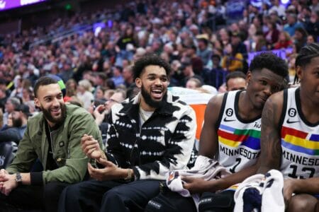 Feb 8, 2023; Salt Lake City, Utah, USA; Minnesota Timberwolves center Rudy Gobert (left) with center Karl-Anthony Towns (middle) and guard Anthony Edwards (1) react to a play by the Utah Jazz in the fourth quarter at Vivint Arena. Mandatory Credit: Rob Gray-USA TODAY Sports (NBA Rumors)