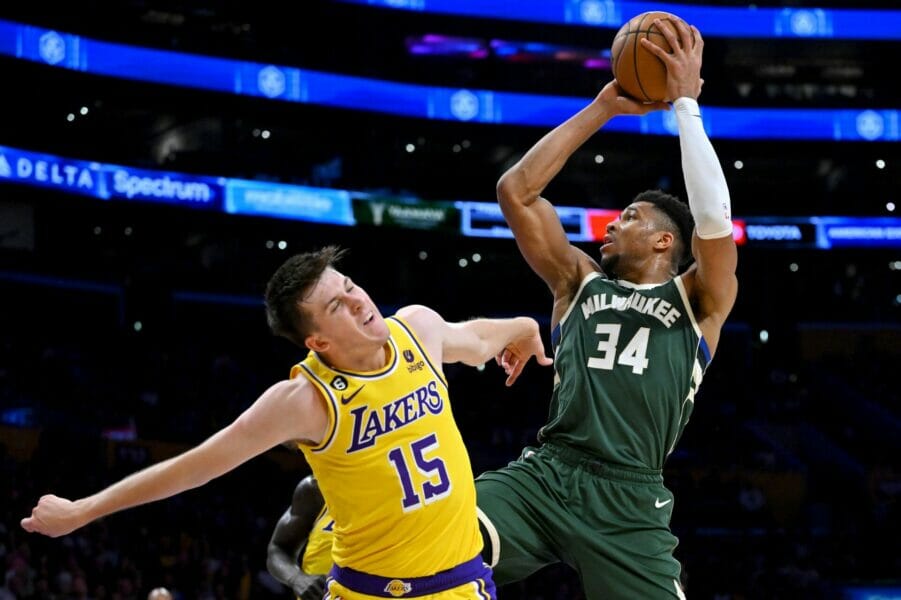 Feb 9, 2023; Los Angeles, California, USA; Los Angeles Lakers guard Austin Reaves (15) defends Milwaukee Bucks forward Giannis Antetokounmpo (34) as he drives to the basket in the first half at Crypto.com Arena. Mandatory Credit: Jayne Kamin-Oncea-USA TODAY Sports (NBA News)