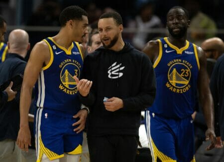 Feb 28, 2023; San Francisco, California, USA; Golden State Warriors guard Jordan Poole (3) confers with injured teammate Stephen Curry during a timeout in the fourth quarter against the Portland Trail Blazers at Chase Center. Mandatory Credit: D. Ross Cameron-USA TODAY Sports (NBA News)