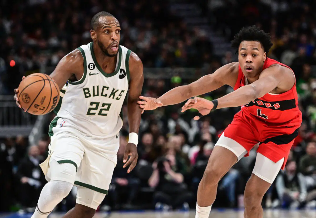 Mar 19, 2023; Milwaukee, Wisconsin, USA; Milwaukee Bucks forward Khris Middleton (22) drives for the basket against Toronto Raptors forward Scottie Barnes (4) in the first quarter at Fiserv Forum. Mandatory Credit: Benny Sieu-USA TODAY Sports (NBA News)