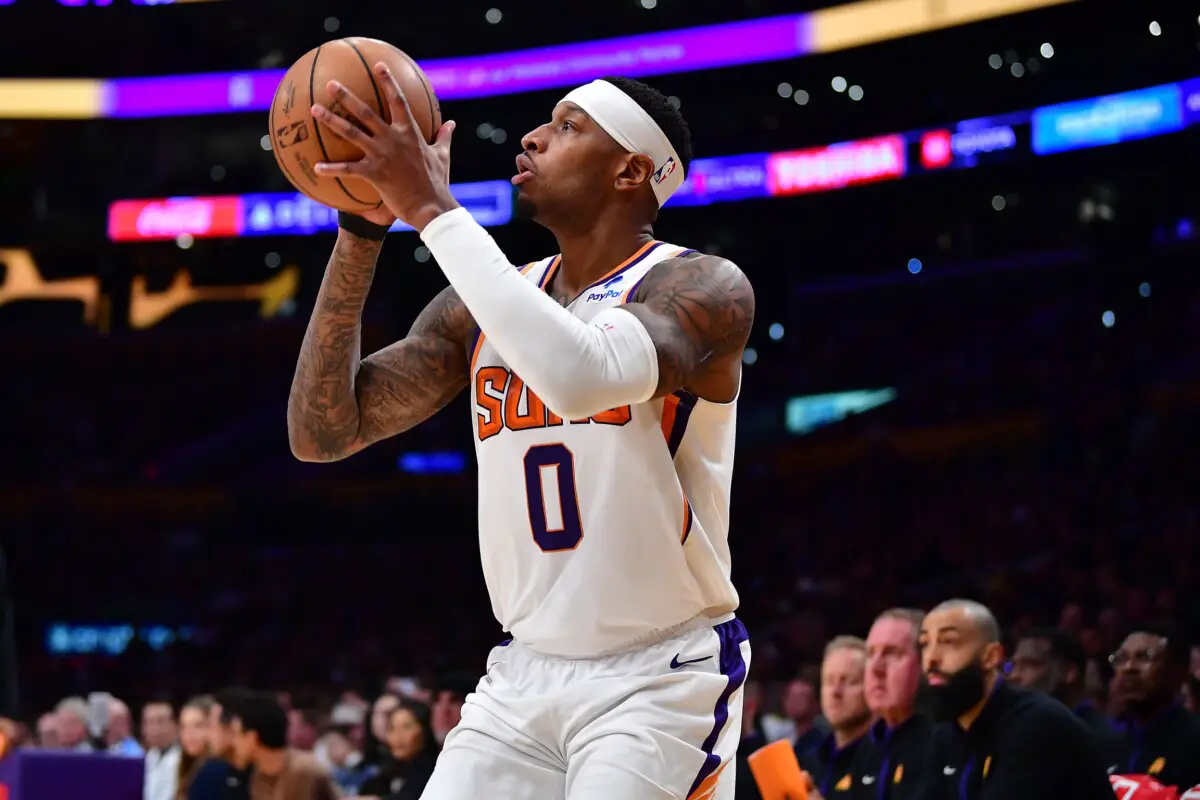 Apr 7, 2023; Los Angeles, California, USA; Phoenix Suns forward Torrey Craig (0) shoots against the Los Angeles Lakers during the second half at Crypto.com Arena. Mandatory Credit: Gary A. Vasquez-USA TODAY Sports (NBA News)