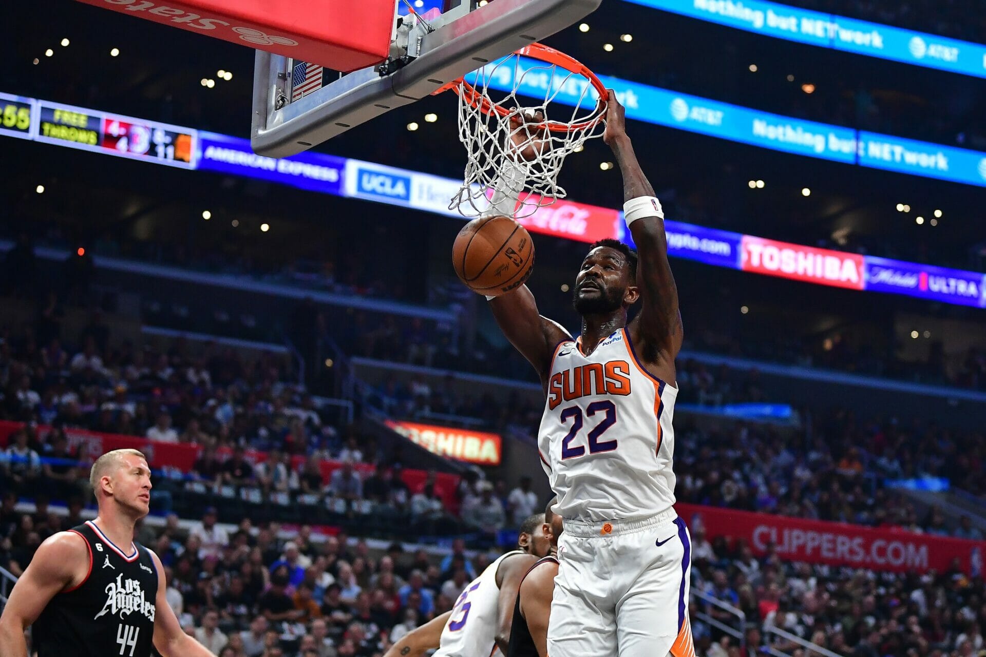 Apr 22, 2023; Los Angeles, California, USA; Phoenix Suns center Deandre Ayton (22) dunks for the basket in front of Los Angeles Clippers center Mason Plumlee (44) during the first half in game four of the 2023 NBA playoffs at Crypto.com Arena. Mandatory Credit: Gary A. Vasquez-USA TODAY Sports (NBA News)