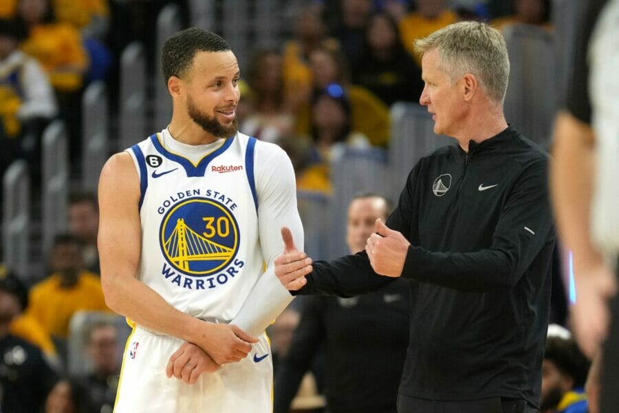 Apr 23, 2023; San Francisco, California, USA; Golden State Warriors guard Stephen Curry (30) talks with head coach Steve Kerr during the third quarter of game four of the 2023 NBA playoffs against the Sacramento Kings at Chase Center. Mandatory Credit: Darren Yamashita-USA TODAY Sports (NBA News)