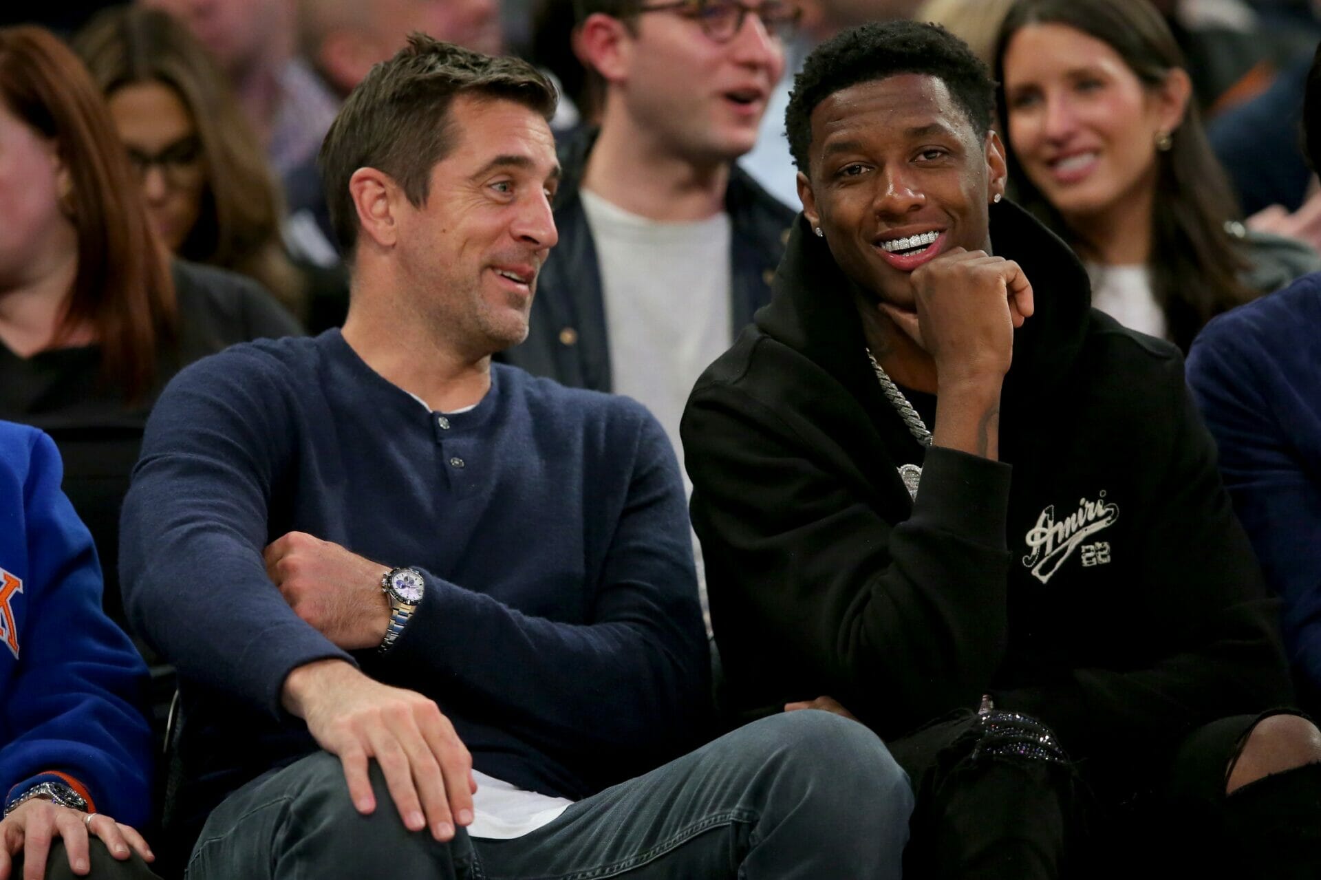 May 2, 2023; New York, New York, USA; New York Jets quarterback Aaron Rodgers (left) and cornerback Sauce Gardner sit court side during the second quarter of game two of the 2023 NBA Eastern Conference semifinal playoffs between the New York Knicks and the Miami Heat at Madison Square Garden. Mandatory Credit: Brad Penner-USA TODAY Sports (NFL News)