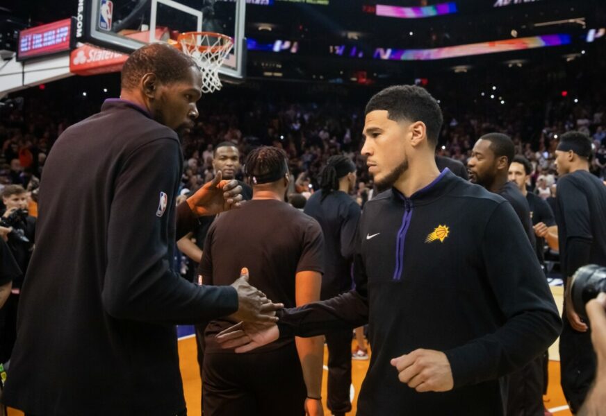 May 5, 2023; Phoenix, Arizona, USA; Phoenix Suns guard Devin Booker (right) with Kevin Durant prior to the game against the Denver Nuggets during game three of the 2023 NBA playoffs at Footprint Center. Mandatory Credit: Mark J. Rebilas-USA TODAY Sports (NBA News - Bucks)
