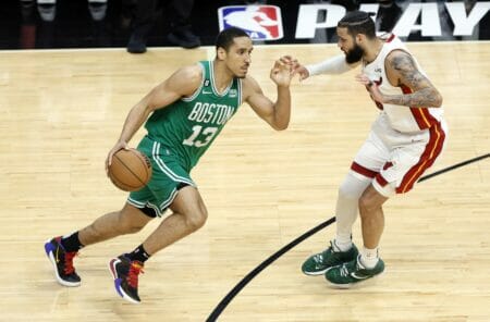 May 23, 2023; Miami, Florida, USA; Boston Celtics guard Malcolm Brogdon (13) controls the ball against Miami Heat forward Caleb Martin (16) in the second quarter during game four of the Eastern Conference Finals for the 2023 NBA playoffs at Kaseya Center. Mandatory Credit: Sam Navarro-USA TODAY Sports (NBA Rumors)