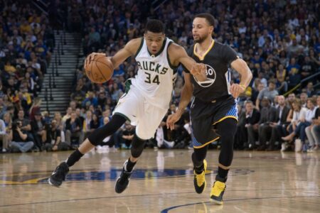 March 18, 2017; Oakland, CA, USA; Milwaukee Bucks forward Giannis Antetokounmpo (34) dribbles the basketball against Golden State Warriors guard Stephen Curry (30) during the second quarter at Oracle Arena. The Warriors defeated the Bucks 117-92. Mandatory Credit: Kyle Terada-USA TODAY Sports (NBA News)