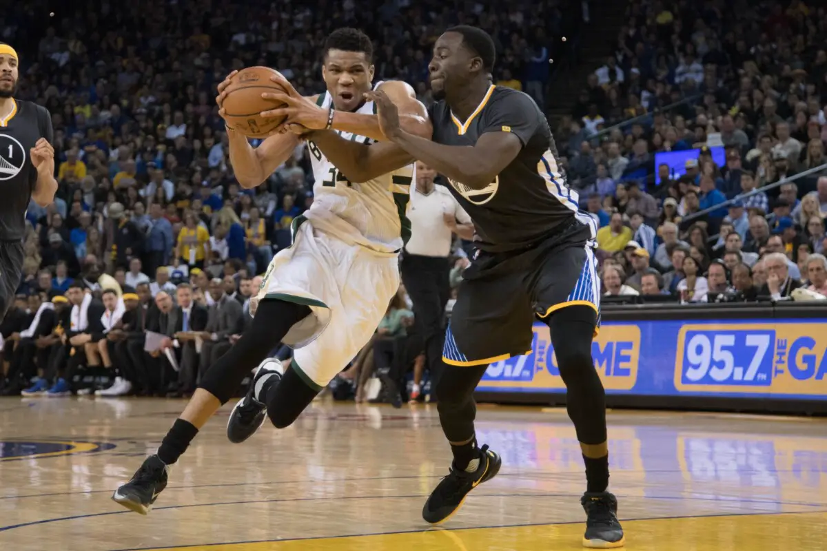 March 18, 2017; Oakland, CA, USA; Milwaukee Bucks forward Giannis Antetokounmpo (34) drives to the basket against Golden State Warriors forward Draymond Green (23) during the second quarter at Oracle Arena. The Warriors defeated the Bucks 117-92. Mandatory Credit: Kyle Terada-USA TODAY Sports (NBA News)