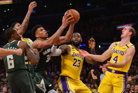 March 6, 2020; Los Angeles, California, USA; Milwaukee Bucks forward Giannis Antetokounmpo (34) grabs a rebound against Los Angeles Lakers forward LeBron James (23) and guard Alex Caruso (4) during the second half at Staples Center. Mandatory Credit: Gary A. Vasquez-USA TODAY Sports (NBA Rumors)