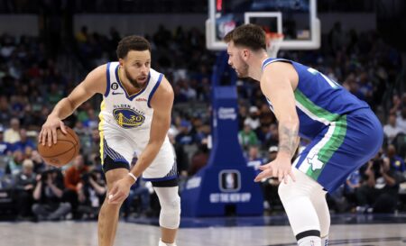 Nov 29, 2022; Dallas, Texas, USA; Golden State Warriors guard Stephen Curry (30) dribbles as Dallas Mavericks guard Luka Doncic (77) defends during the first quarter at American Airlines Center. Mandatory Credit: Kevin Jairaj-USA TODAY Sports