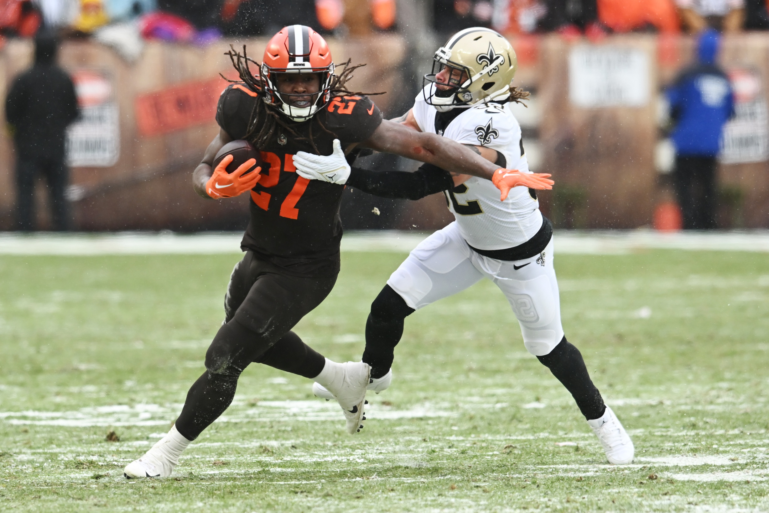 Dec 24, 2022; Cleveland, Ohio, USA; New Orleans Saints safety Tyrann Mathieu (32) tackles Cleveland Browns running back Kareem Hunt (27) during the first half at FirstEnergy Stadium. Mandatory Credit: Ken Blaze-USA TODAY Sports NFC North News