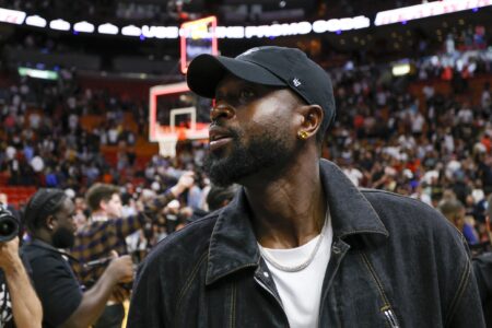 Mar 22, 2023; Miami, Florida, USA; Former Miami Heat player Dwyane Wade looks on after the game between the Miami Heat and New York Knicks at Miami-Dade Arena. Mandatory Credit: Sam Navarro-USA TODAY Sports (NBA News)