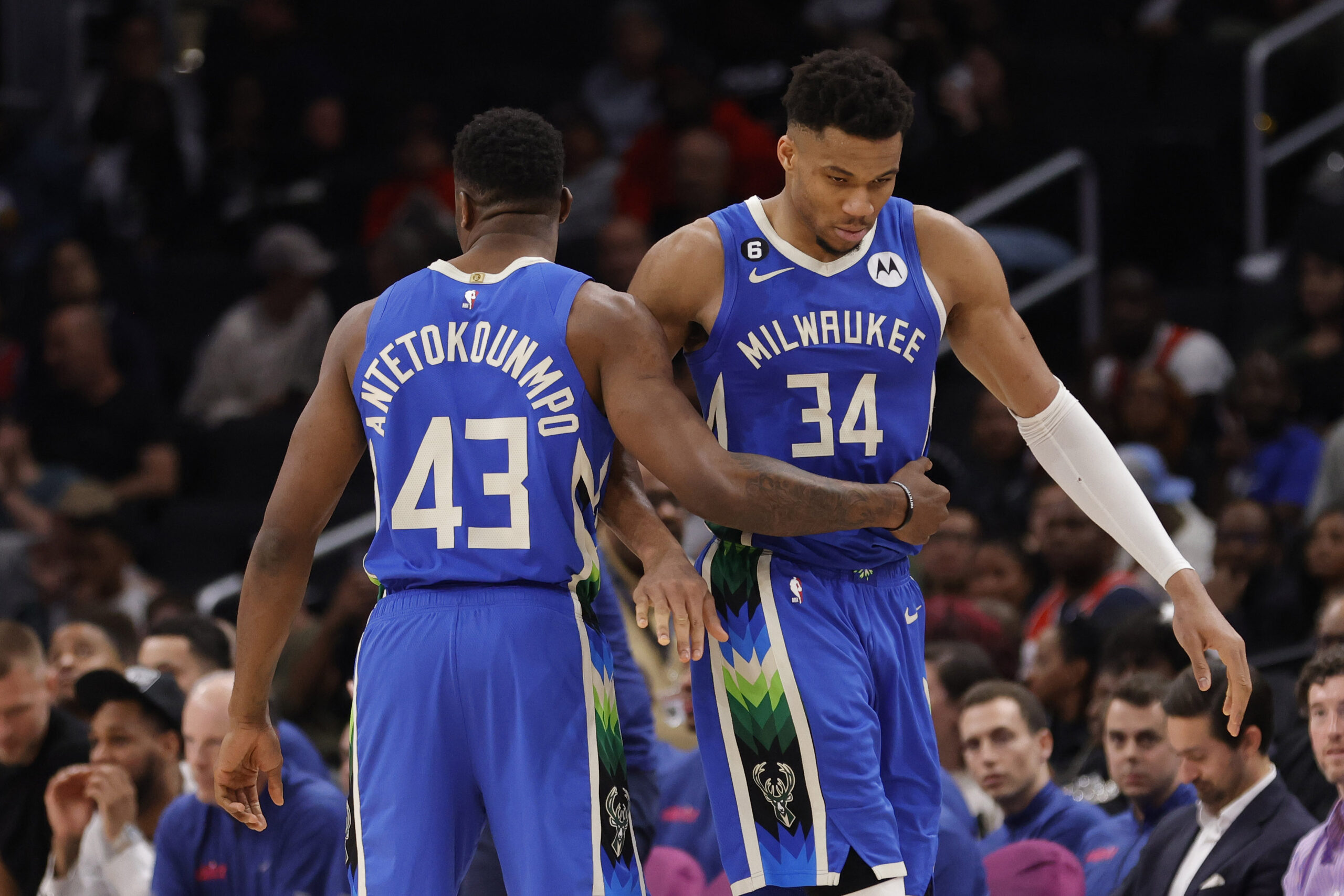 Apr 4, 2023; Washington, District of Columbia, USA; Milwaukee Bucks forward Giannis Antetokounmpo (34) hugs his brother, Bucks forward Thanasis Antetokounmpo (43), while walking off the floor against the Washington Wizards in the fourth quarter at Capital One Arena. Mandatory Credit: Geoff Burke-USA TODAY Sports