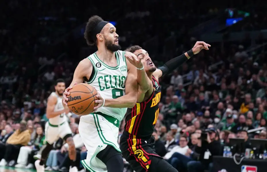 Apr 18, 2023; Boston, Massachusetts, USA; Boston Celtics guard Derrick White (9) drives the ball against Atlanta Hawks guard Trae Young (11) in the first quarter during game two of the 2023 NBA playoffs at TD Garden. Mandatory Credit: David Butler II-USA TODAY Sports NBA News