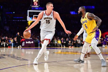 May 22, 2023; Los Angeles, California, USA; Denver Nuggets center Nikola Jokic (15) drives to the basket against Los Angeles Lakers forward LeBron James (6) during the second quarter in game four of the Western Conference Finals for the 2023 NBA playoffs at Crypto.com Arena. Mandatory Credit: Gary A. Vasquez-USA TODAY Sports (NBA News)