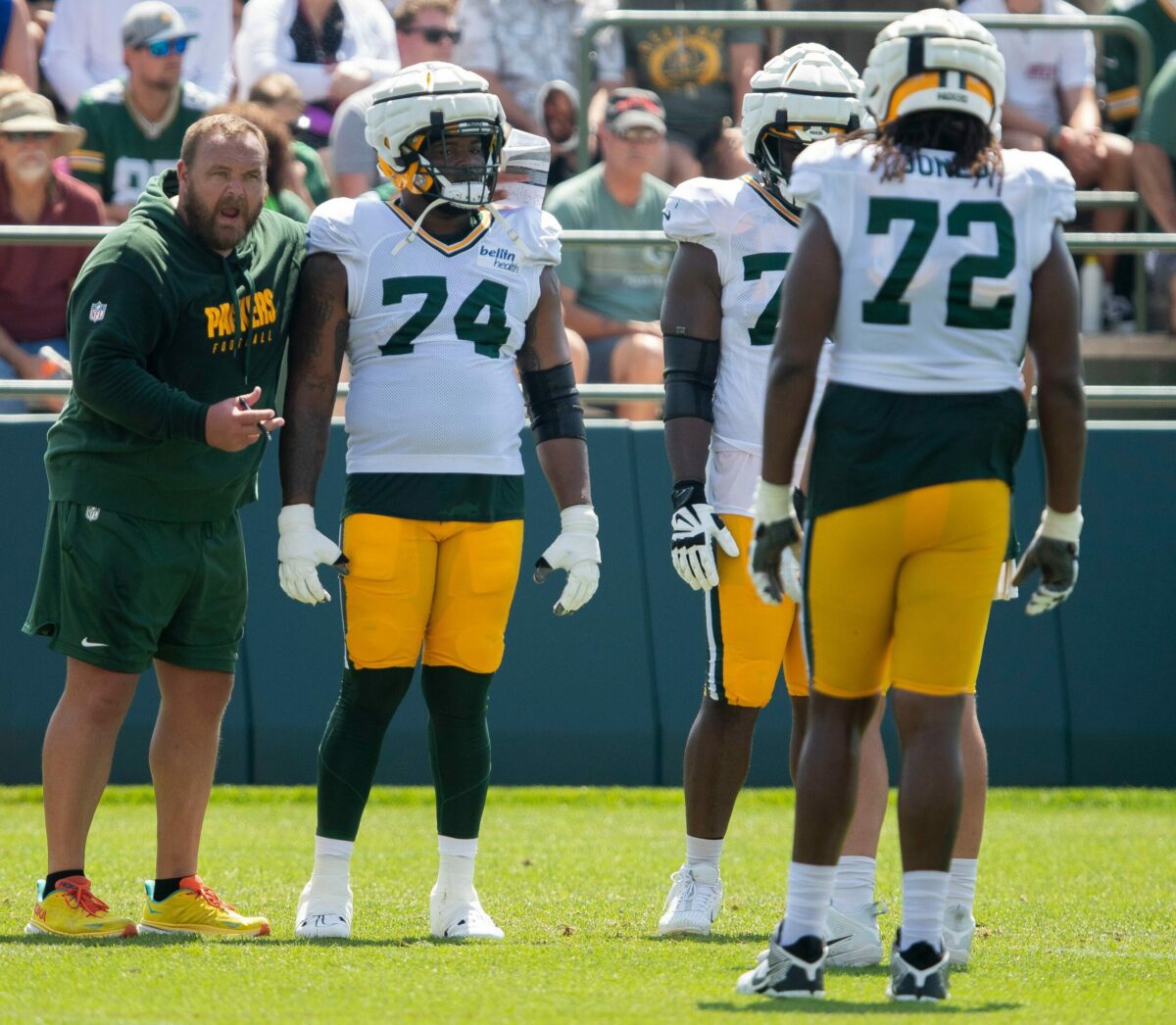 Green Bay Packers offensive line coach Luke Butkus gives instructions to guard Elgton Jenkins (74) and offensive tackle Caleb Jones (72) during practice on Thursday, August 3, 2023, at Ray Nitschke Field in Green Bay, Wis. Tork Mason/USA TODAY NETWORK-Wisconsin (NFL)
