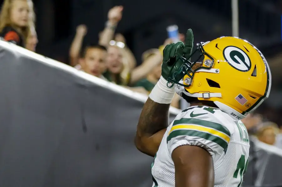 Aug 11, 2023; Cincinnati, Ohio, USA; Green Bay Packers running back Emanuel Wilson (31) reacts after scoring a touchdown against the Cincinnati Bengals in the second half at Paycor Stadium. Mandatory Credit: Katie Stratman-USA TODAY Sports