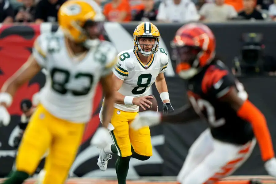 Green Bay Packers quarterback Sean Clifford (8) eyes a pass to Green Bay Packers wide receiver Samori Toure (83), left, in the second quarter during a Week 1 NFL preseason game between the Green Bay Packers and the Cincinnati Bengals,Friday, Aug. 11, 2023, at Paycor Stadium in Cincinnati.