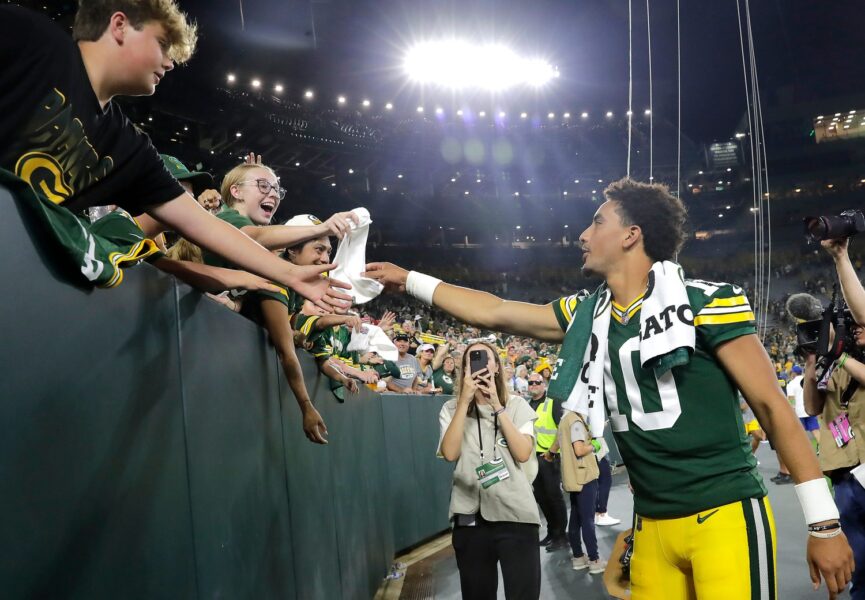 Green Bay Packers quarterback Jordan Love (10) passes a towel to a youg fan following the Packers’ during their preseason football game against the New England Patriots on Saturday, August 19, 2023, at Lambeau Field in Green Bay, Wis. The game was suspended in the fourth quarter following an injury to New England Patriots cornerback Isaiah Bolden (7). Wm. Glasheen USA TODAY NETWORK-Wisconsin