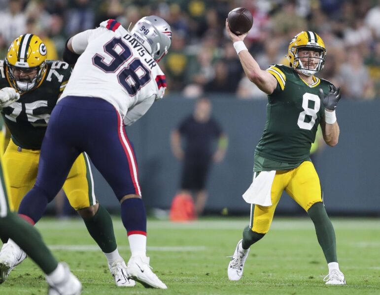 Aug 19, 2023; Green Bay, WI, USA; Green Bay Packers quarterback Sean Clifford (8) passes the ball against the New England Patriots during their preseason football game at Lambeau Field. The game was suspended in the fourth quarter following an injury to New England Patriots cornerback Isaiah Bolden (7). Mandatory Credit: Tork Mason-USA TODAY Sports