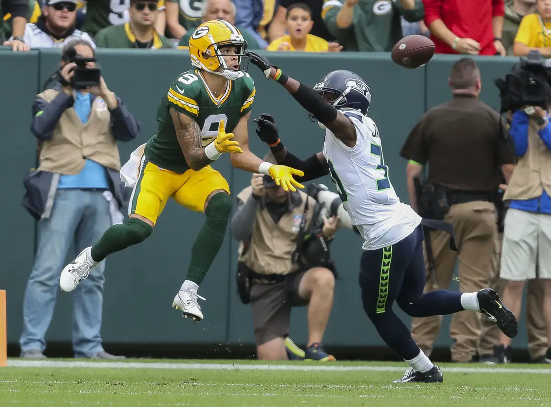 NFL: Green Bay Packers wide receiver Christian Watson catches a touchdown pass from Jordan Love
