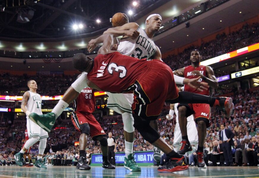 May 7, 2011; Boston, MA, USA; Boston Celtics small forward Paul Pierce (34) battles for a loose ball with Miami Heat shooting guard Dwyane Wade (3) in the first half of game three of the second round of the 2011 NBA playoffs at TD Garden. Mandatory Credit: David Butler II-USA TODAY Sports NBA News