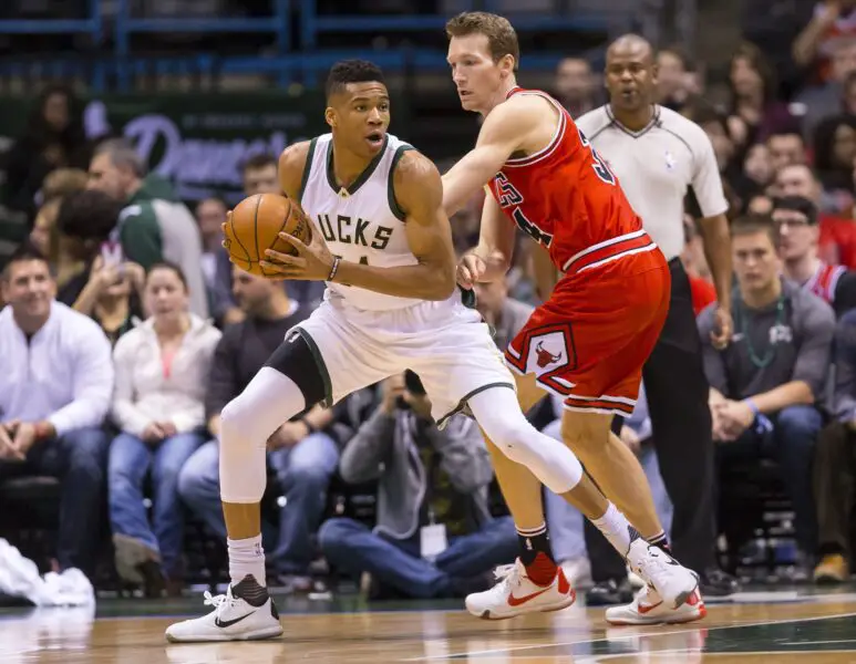 Apr 3, 2016; Milwaukee, WI, USA; Milwaukee Bucks forward Giannis Antetokounmpo (34) holds the ball as Chicago Bulls guard Mike Dunleavy (34) defends during the first quarter at BMO Harris Bradley Center. Mandatory Credit: Jeff Hanisch-USA TODAY Sports (NBA News)