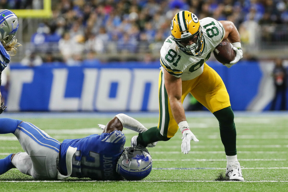 Nov 6, 2022; Detroit, Michigan, USA; Detroit Lions cornerback Jerry Jacobs (39) tries to tackle Green Bay Packers tight end Josiah Deguara (81) during the second half at Ford Field. Mandatory Credit: Junfu Han-USA TODAY Sports