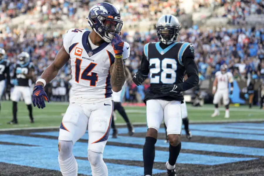 Nov 27, 2022; Charlotte, North Carolina, USA; Denver Broncos wide receiver Courtland Sutton (14) watches the pass fly behind him defended by Carolina Panthers cornerback Donte Jackson (26) during the second half at Bank of America Stadium. Mandatory Credit: Jim Dedmon-USA TODAY Sports
