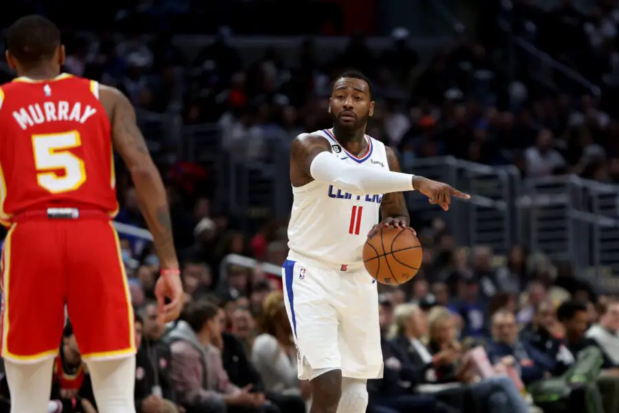 Jan 8, 2023; Los Angeles, California, USA; Los Angeles Clippers guard John Wall (11) dribbles the ball against Atlanta Hawks guard Dejounte Murray (5) during the fourth quarter at Crypto.com Arena. Mandatory Credit: Kiyoshi Mio-USA TODAY Sports (Milwaukee Bucks)