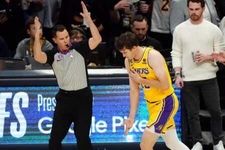 May 18, 2023; Denver, Colorado, USA; Los Angeles Lakers guard Austin Reaves (15) celebrates in the first quarter against the Denver Nuggets during game two of the Western Conference Finals for the 2023 NBA playoffs at Ball Arena. Mandatory Credit: Ron Chenoy-USA TODAY Sports