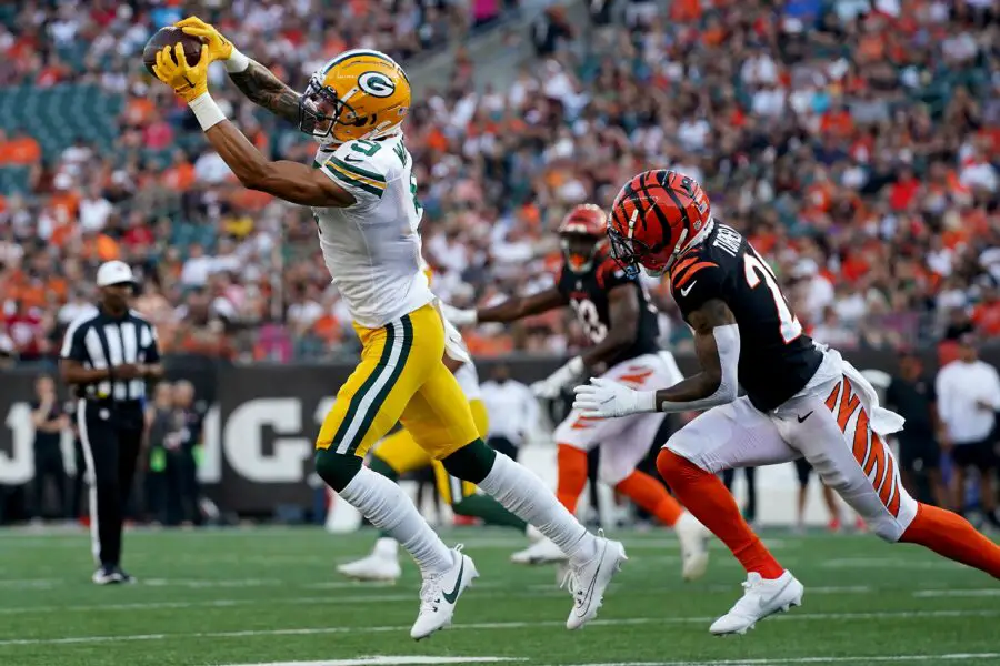 Green Bay Packers wide receiver Christian Watson (9) extends to catch a pass as Cincinnati Bengals cornerback DJ Turner II (20) defends In the first quarter during a Week 1 NFL preseason game between the Green Bay Packers and the Cincinnati Bengals,Friday, Aug. 11, 2023, at Paycor Stadium in Cincinnati.