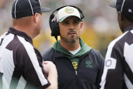 Aug 26, 2023; Green Bay, Wisconsin, USA; Green Bay Packers head coach Matt LaFleur talks with officials during the first quarter against the Seattle Seahawks at Lambeau Field. Mandatory Credit: Jeff Hanisch-USA TODAY Sports Wisconsin Badgers