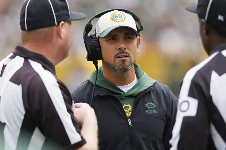 Aug 26, 2023; Green Bay, Wisconsin, USA; Green Bay Packers head coach Matt LaFleur talks with officials during the first quarter against the Seattle Seahawks at Lambeau Field. Mandatory Credit: Jeff Hanisch-USA TODAY Sports Wisconsin Badgers