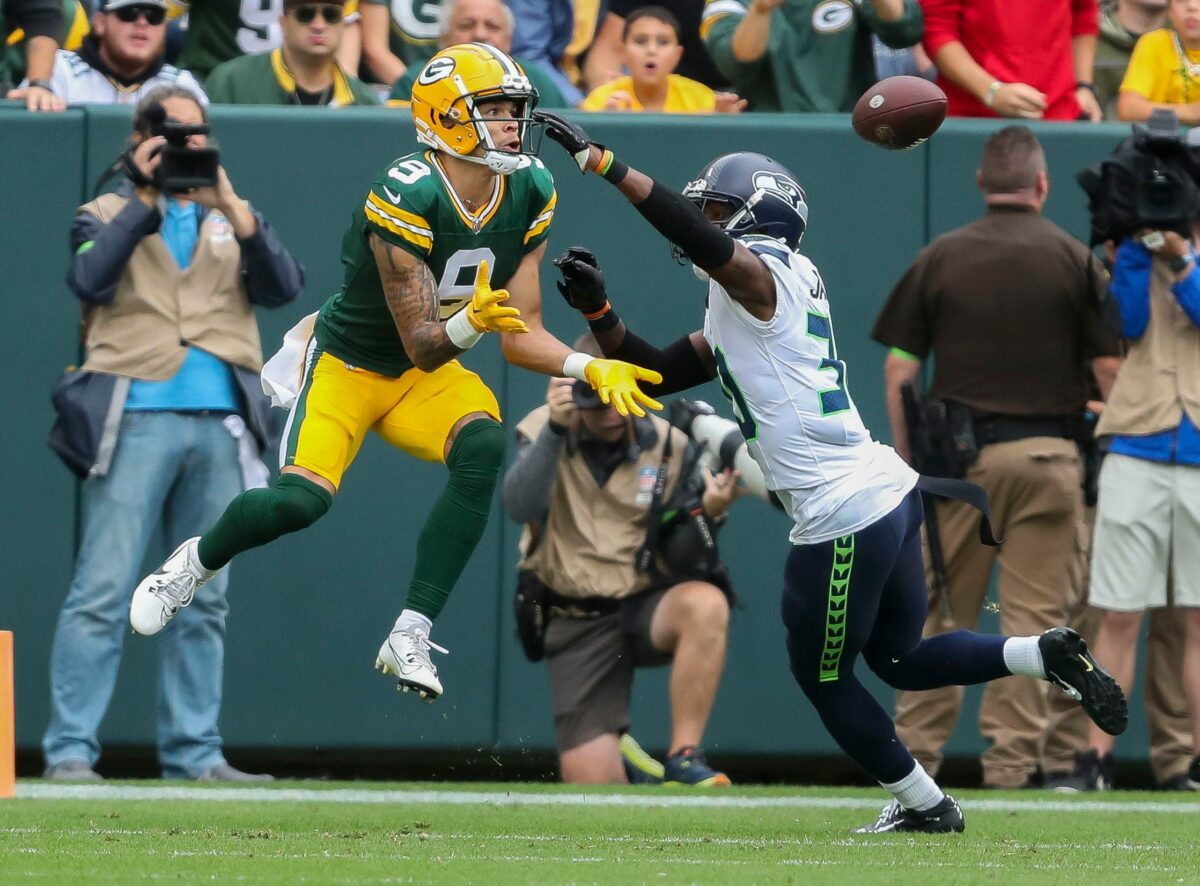 Green Bay Packers wide receiver Christian Watson (9) catches a touchdown pass against Seattle Seahawks cornerback Michael Jackson (30) during their preseason football game on Saturday, August 26, 2023, at Lambeau Field in Green Bay, Wis. Tork Mason/USA TODAY NETWORK-Wisconsin