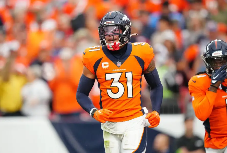 Sep 10, 2023; Denver, Colorado, USA; Denver Broncos safety Justin Simmons (31) reacts to a turnover in the third quarter against the Las Vegas Raiders at Empower Field at Mile High. Mandatory Credit: Ron Chenoy-USA TODAY Sports (Green Bay Packers)