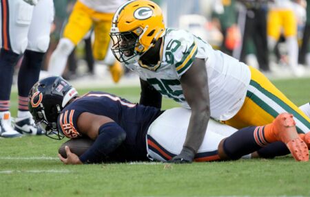 Green Bay Packers defensive tackle Colby Wooden (96) sacks Chicago Bears quarterback Justin Fields (1) during second half of their game on Sunday, Sept. 10, 2023 at Soldier Field in Chicago.