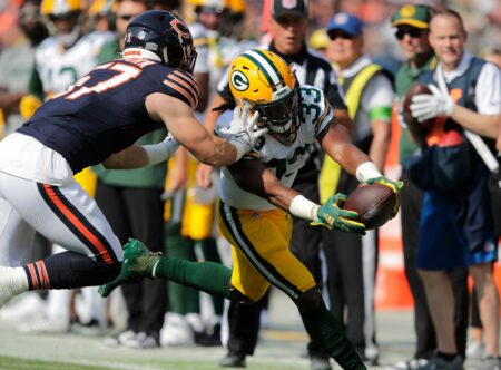Green Bay Packers running back Aaron Jones (33) lunges for a first down against Chicago Bears linebacker Jack Sanborn (57) in the first quarter during their football game Sunday, September 10, 2023, at Soldier Field in Chicago, Ill. © Dan Powers/USA TODAY NETWORK-Wisconsin / USA TODAY NETWORK Patrick Taylor