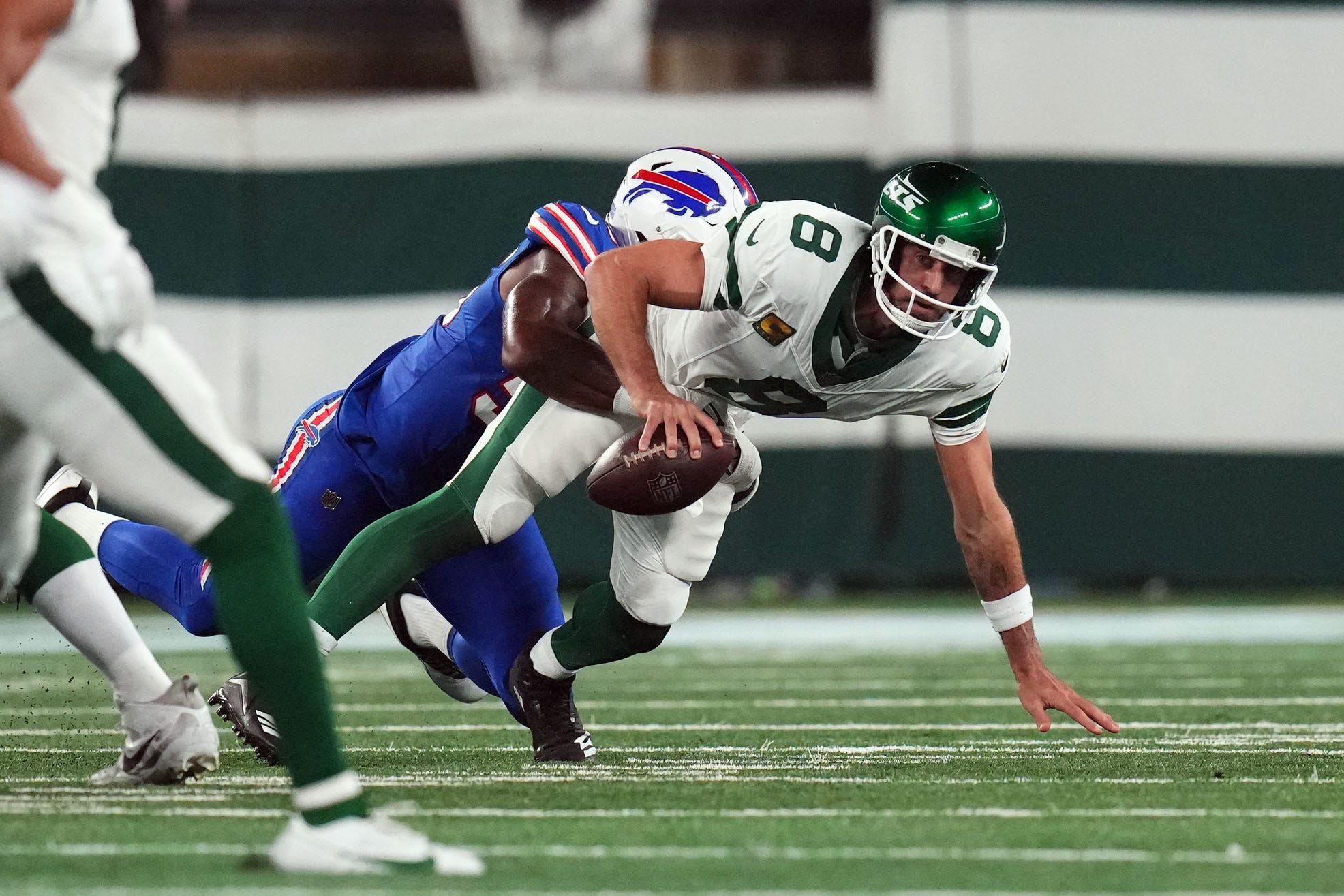 Buffalo Bills defensive end Leonard Floyd (56) sacks New York Jets quarterback Aaron Rodgers (8) early in the first quarter during the home opener at MetLife Stadium on Monday, Sept. 11, 2023, in East Rutherford. Rodgers was carted off the field after being hit.