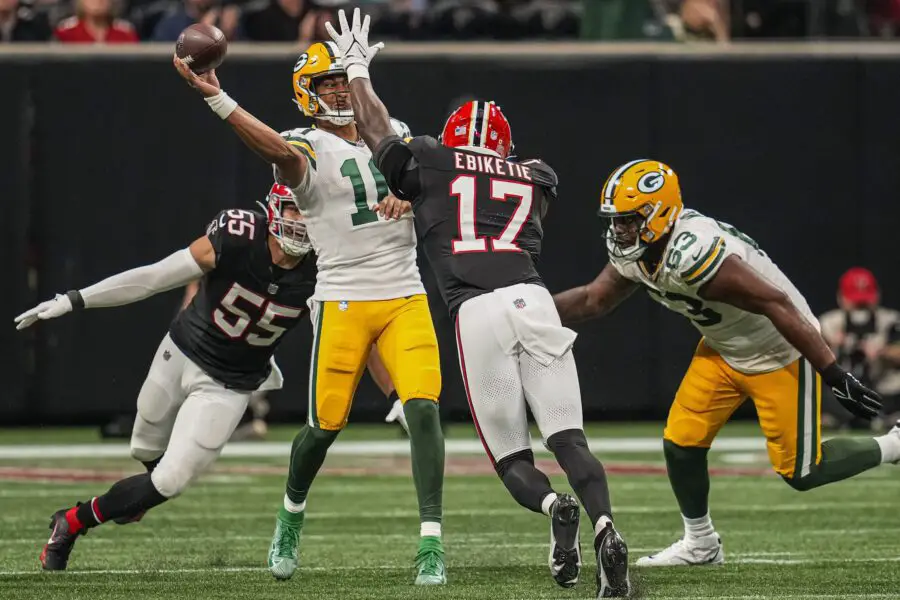 Sep 17, 2023; Atlanta, Georgia, USA; Green Bay Packers quarterback Jordan Love (10) passes under pressure from Atlanta Falcons linebacker Kaden Elliss (55) and linebacker Arnold Ebiketie (17) during the second half at Mercedes-Benz Stadium. Mandatory Credit: Dale Zanine-USA TODAY Sports