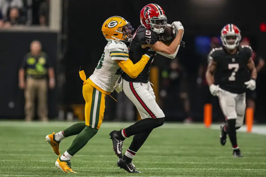 Sep 17, 2023; Atlanta, Georgia, USA; Atlanta Falcons wide receiver Drake London (5) makes a catch against Green Bay Packers cornerback Jaire Alexander (23) during the second half at Mercedes-Benz Stadium. Mandatory Credit: Dale Zanine-USA TODAY Sports