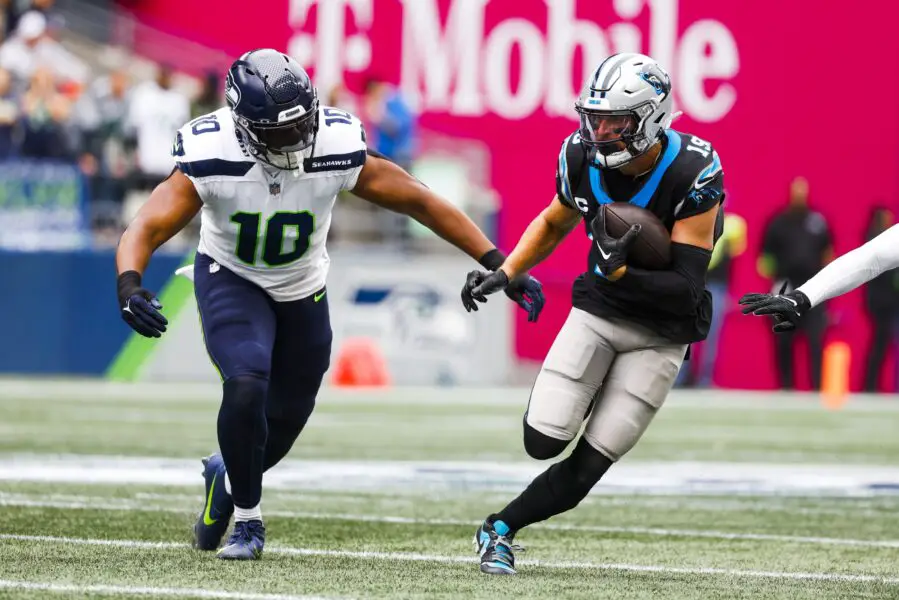 Sep 24, 2023; Seattle, Washington, USA; Carolina Panthers wide receiver Adam Thielen (19) runs for yards after the catch against Seattle Seahawks linebacker Uchenna Nwosu (10) during the first quarter at Lumen Field. Mandatory Credit: Joe Nicholson-USA TODAY Sports (Green Bay Packers)