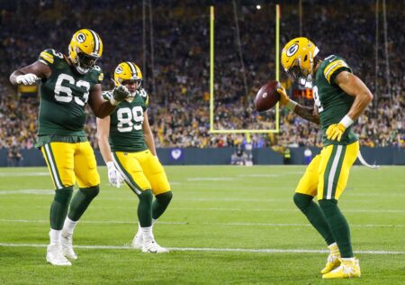 Green Bay Packers wide receiver Christian Watson celebrates catching a touchdown thrown by Jordan Love