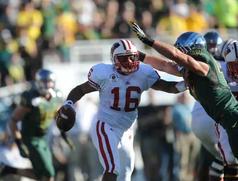 Jan 2, 2012; Pasadena, CA, USA; Oregon Ducks linebacker Kiko Alonso (47) sacks Wisconsin Badgers quarterback Russell Wilson (16) for a Wisconsin loss of 7-yards during the first half in the 2012 Rose Bowl game at the Rose Bowl. Mandatory Credit: Jayne Kamin-Oncea-USA TODAY Sports